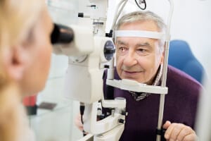 Elderly man having an eye exam