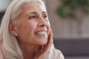 Elderly woman smiling after a Cornea Transplant