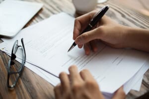 Woman filling out Patient Forms