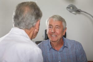 Eye Doctor discussing dry eyes with a patient