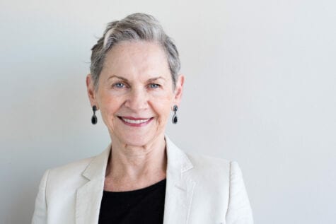 Older woman smiling after eye surgery