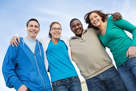 Group of people smiling after IPL Treatment